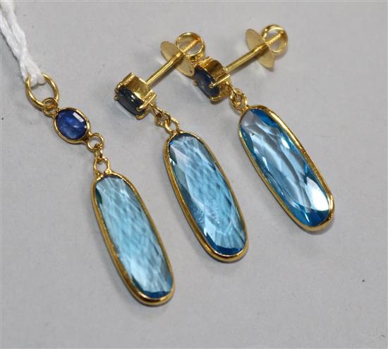A 14ct gold, blue topaz and sapphire suite of jewellery comprising a pendant and pair of earrings, pendant